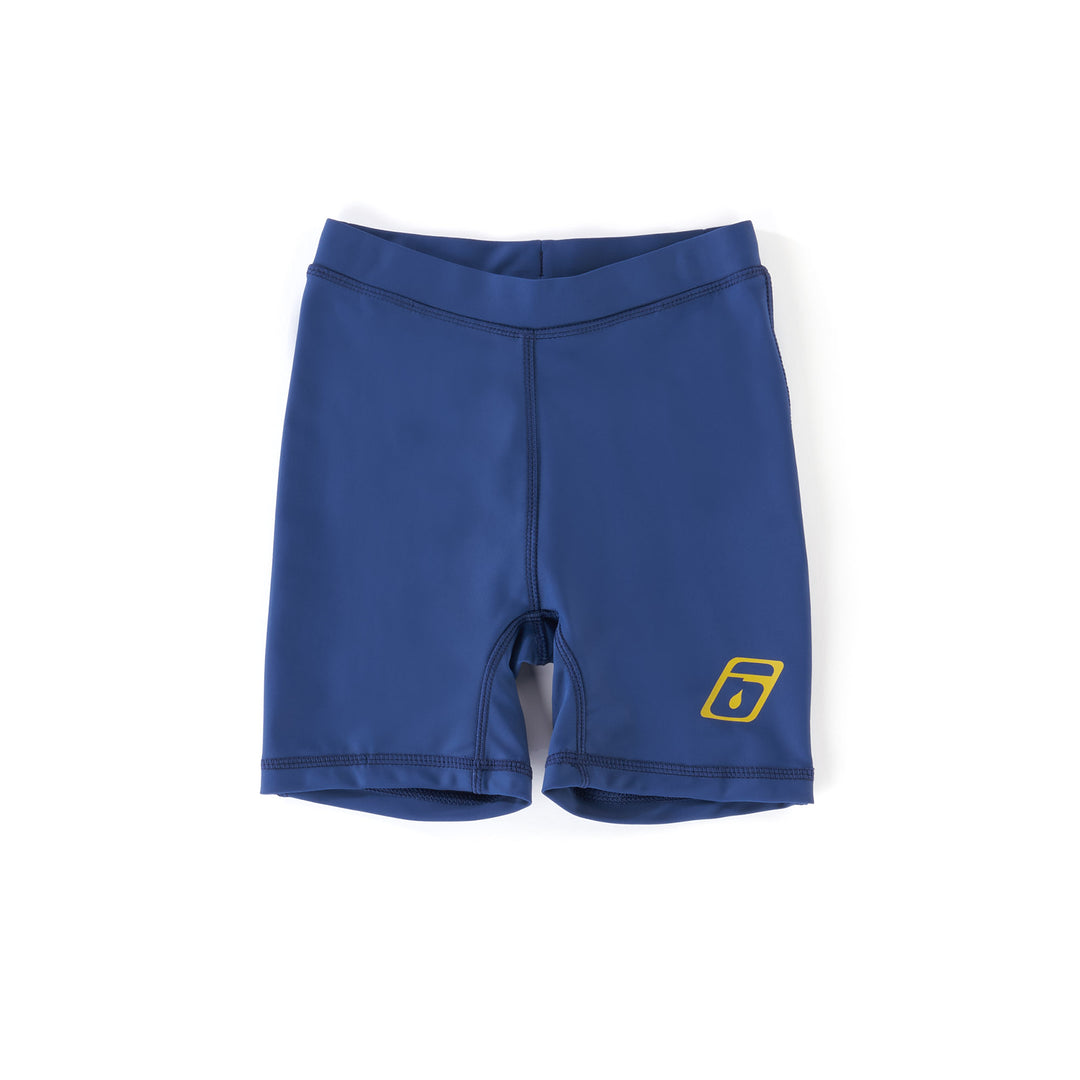 A pair of blue lycra shorts for kids with a small yellow logo on the left leg.